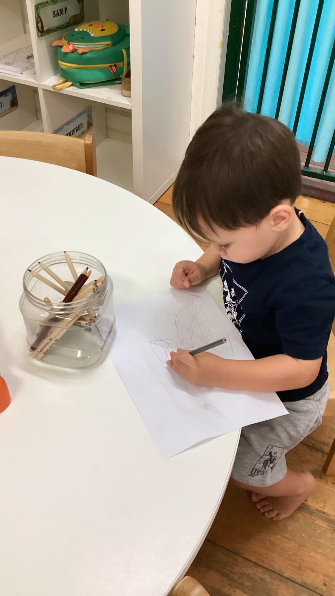 Child drawing on paper - Seedlings Early Learning and Childcare
