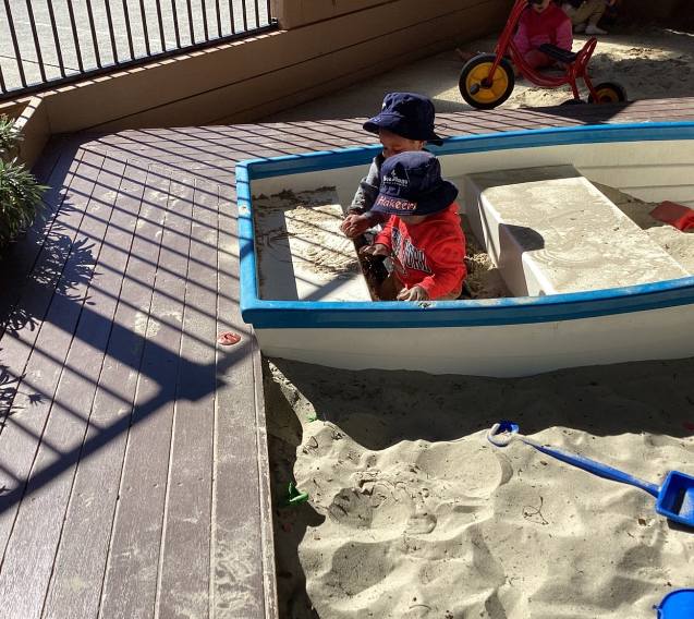 Two kids playing in a sandpit - Seedlings Early Learning and Childcare