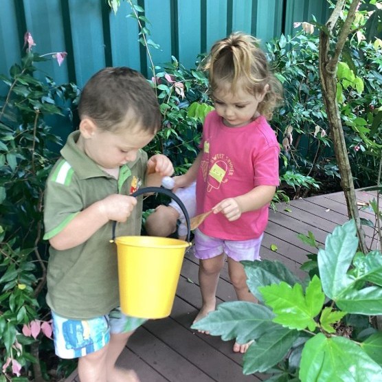Two kids playing with pail - Seedlings Early Learning and Childcare